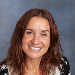 Portrait of woman wearing black and white sweater